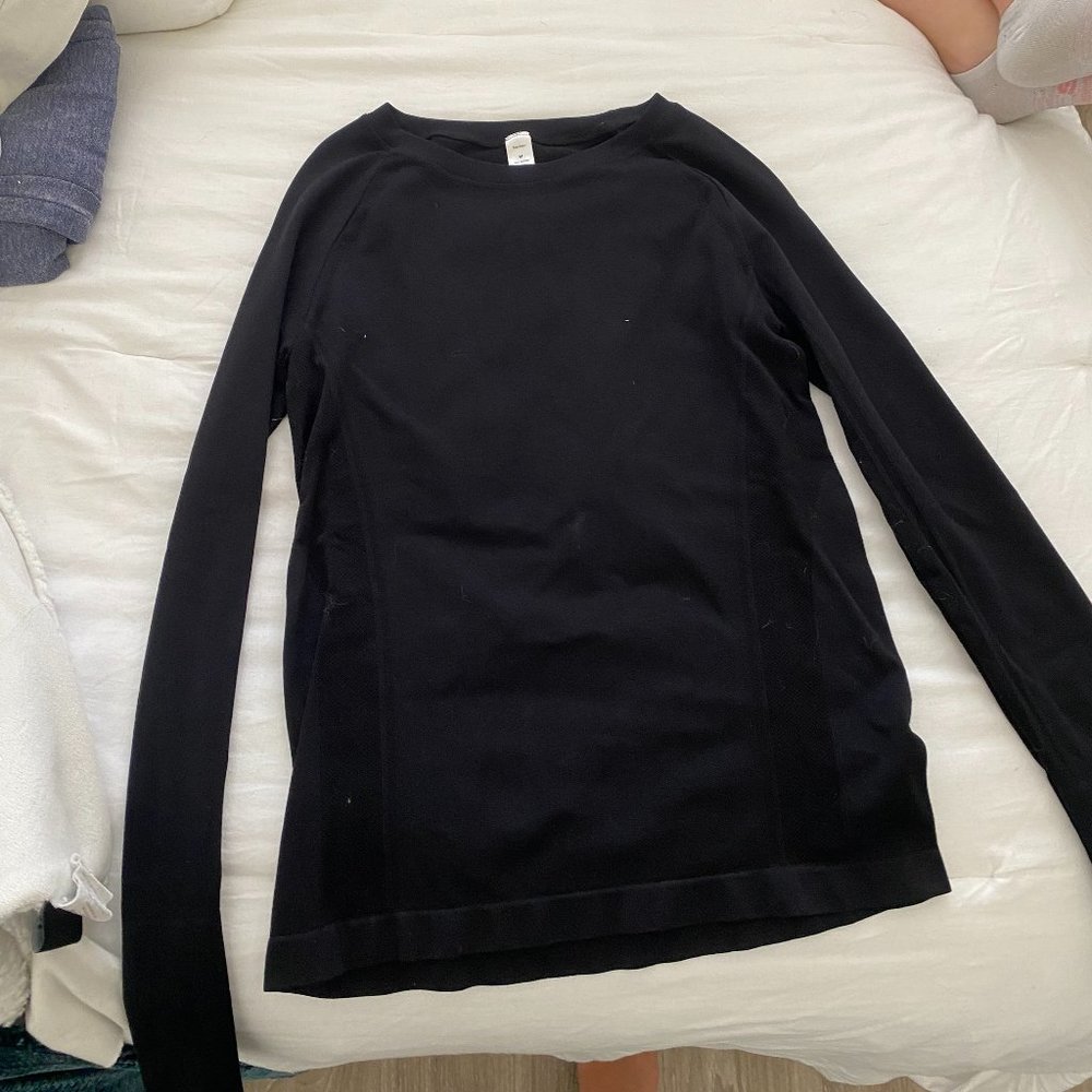 Black long sleeve athletic shirt with thumb holes